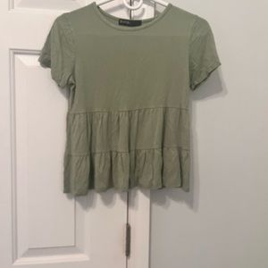 Waist length ruffled shirt